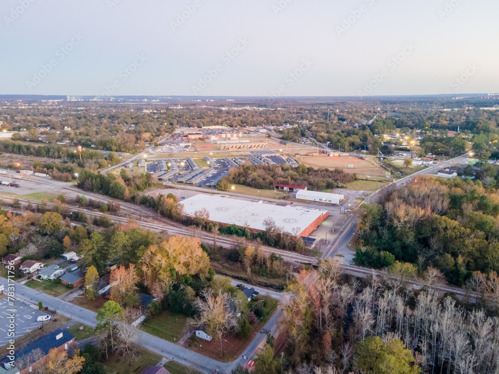 Aerial landscape of forest and suburban neighborhood at sunset in Augusta Georgia