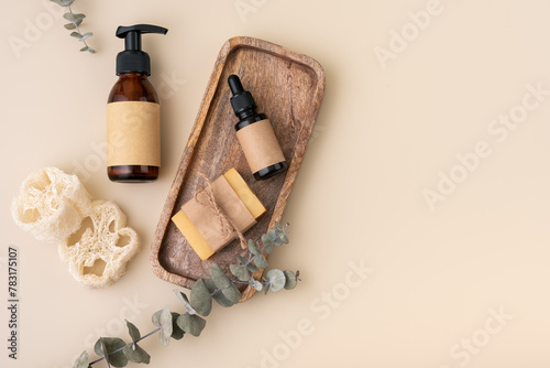 Eco-friendly selfcare accessories concept with loofah sponges, cosmetic glass bottles and eucalyptus © viktoriya89
