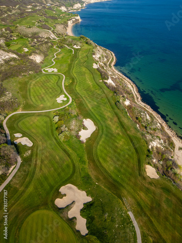 Aerial View of Golf Course by the Sea © sandsun