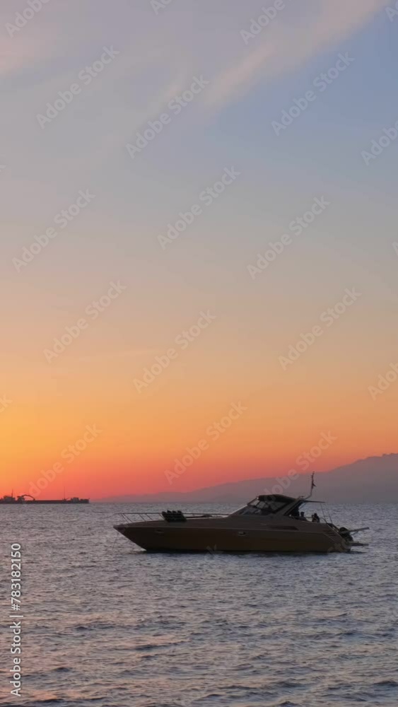 Sunset in Mykonos island, Greece, with cruise ship and yachts in the harbor and colorful waterfront houses of Little Venice romantic spot. Mykonos town, Greece. Camera pan Sunset in Mykonos island, Greece, with cruise ship and yachts in the harbor and colorful waterfront houses of Little Venice romantic spot. Mykonos town, Greece. Camera pan