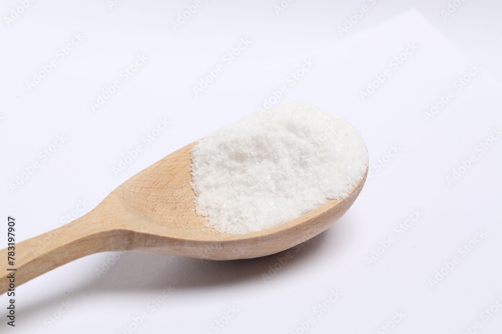 Natural salt in wooden spoon isolated on white Natural salt in wooden spoon isolated on white