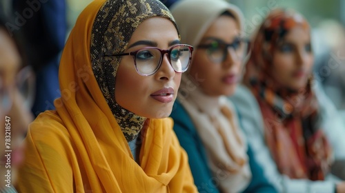 Diverse hijabi businesswomen work collaboratively to overcome challenges photo