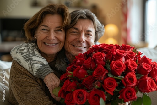 Senior mother and old son. Mother's Day roses. Old mother and son on Mother's Day. Old mother and adult son © Anastasia