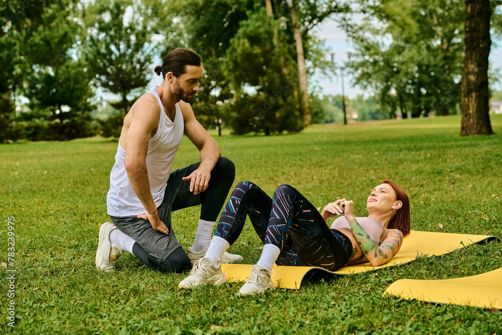 A woman sportswear on a yellow mat outdoors, guided by their personal trainer in a yoga session filled with determination and motivation. A woman sportswear on a yellow mat outdoors, guided by their personal trainer in a yoga session filled with determination and motivation.
