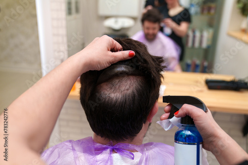 Wallpaper Mural A stylist ensures hairpiece hygiene with expert cleaning Torontodigital.ca
