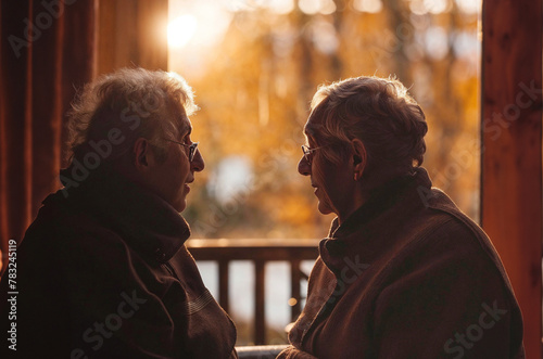Golden Twilight Tales: Seniors in a Retirement Home Engaged in Heartfelt Dialogue, Generative AI photo