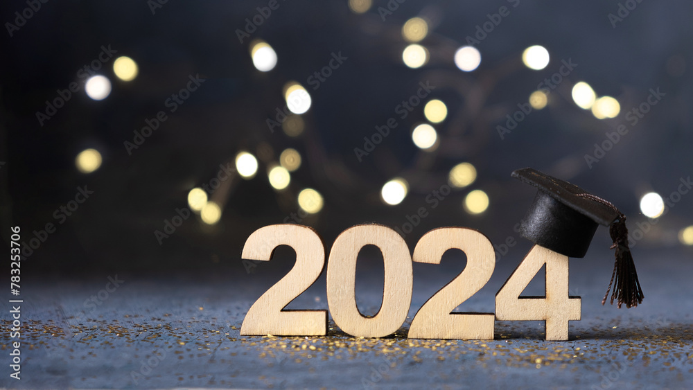 Obraz premium Class of 2024 concept. Number 2024 with graduated cap and bokeh lights banner.