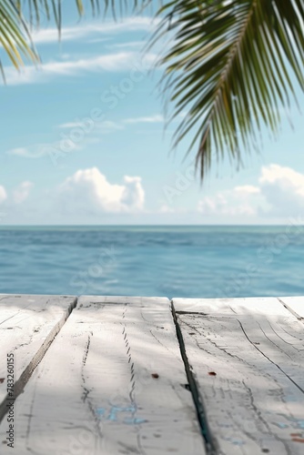 A wooden table with a beautiful view of the ocean. Perfect for travel and vacation concepts