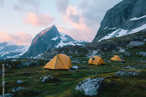 Tent in the mountains. Climbers setting up mountain camp, adventurous, expedition, camping essentials. Warm, evening sunlight. Nature and camping photography style.