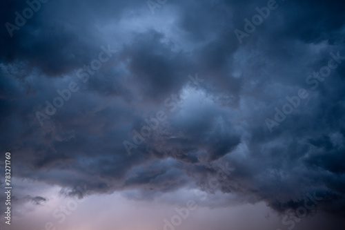 Stormy sky clouds at sunset photo