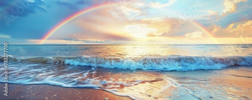A rainbow arching over the ocean, with gentle waves lapping at the shore, symbolizing hope and joy in natures display of beauty. A rainbow over the beach at sunrise #783277700