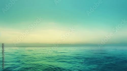 A gradient background transitioning smoothly from blue to green, creating a serene and tranquil ambiance © KerXing