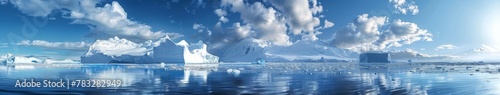 Icebergs floating in the ocean with blue sky and clouds © BrandwayArt