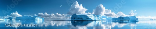 Group of icebergs floating on top of a body of water