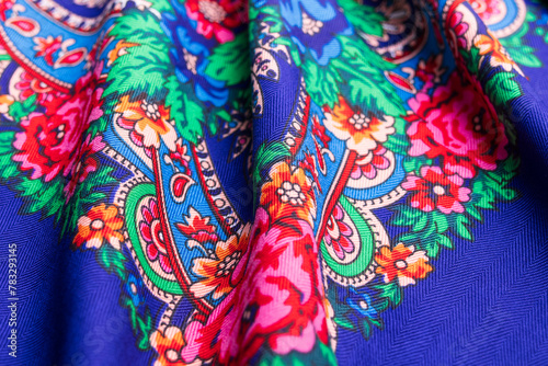 Blue Russian winter scarf with vivid floral design.