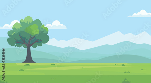 a green tree in a field with mountains in the background