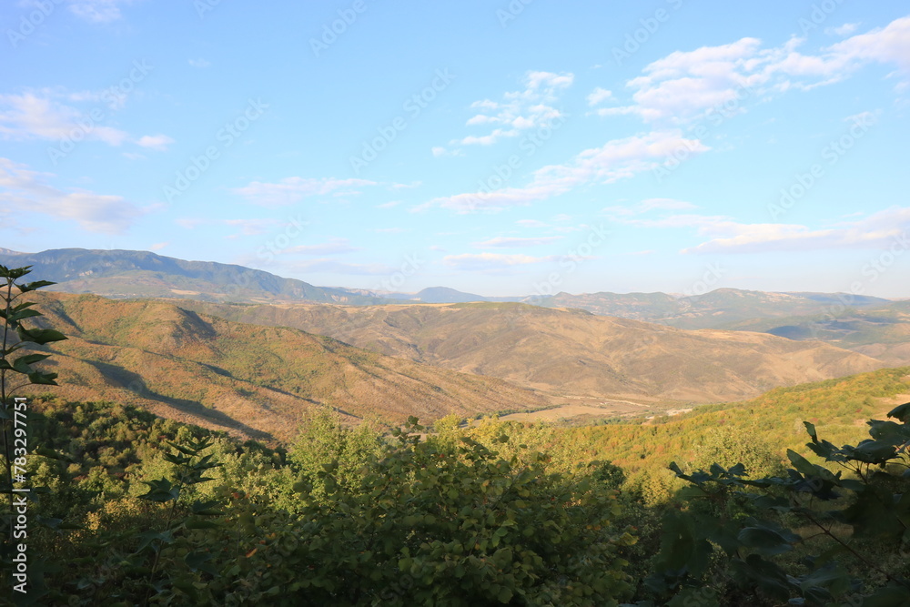 Naklejka premium landscape , mountains , trees and blue sky , nature