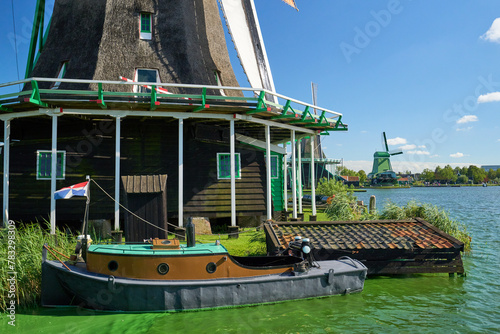Archetypal Holland windmills & Dutch boat - tourism travel destination photo