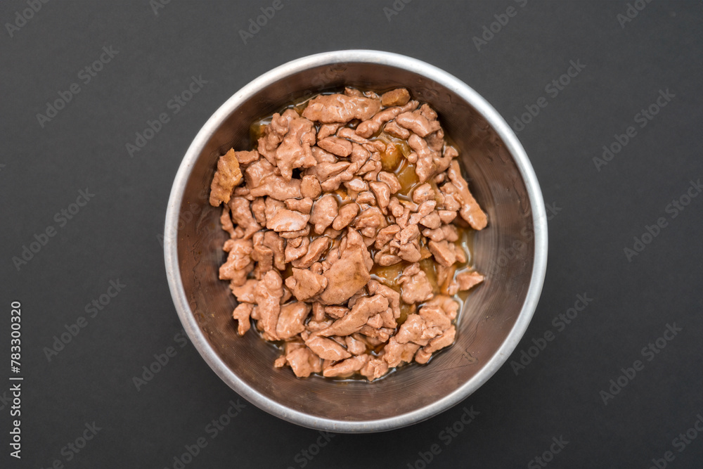 Food for animals background. wet cat and dog food texture, pattern. Pet meal background close up. wet food for pet dogs and cats. Dried pet food top view. Granules of good nutrition for dogs and cats. Food for animals background. wet cat and dog food texture, pattern. Pet meal background close up. wet food for pet dogs and cats. Dried pet food top view. Granules of good nutrition for dogs and cats.