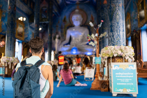 Woman in the Blue Temple at Chiang Rai. photo