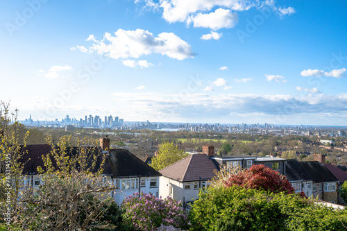 Houses in the Royal Borough of Greenwich overlooking Woolwich Common and distant London city skyline in spring, England
