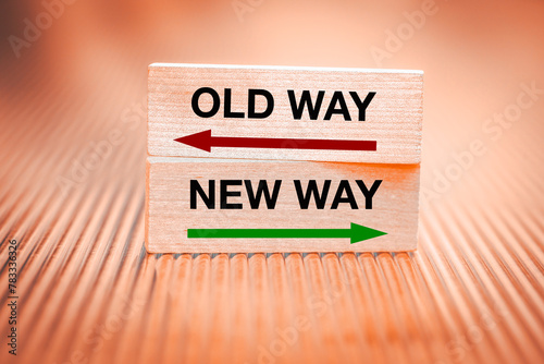New way vs old way. Concept, New opportunities, direction of development, Written on wooden blocks, Fiery background