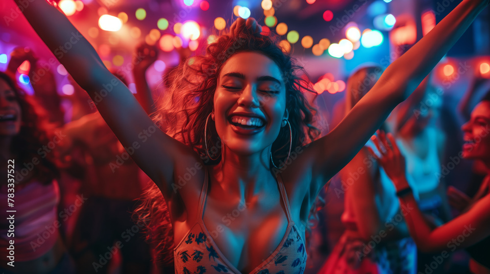 A woman is dancing and smiling in a club with other people. Scene is lively and fun A woman is dancing and smiling in a club with other people. Scene is lively and fun