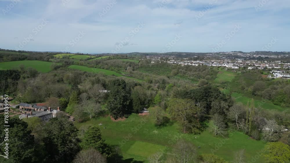 Cockington, Torbay, South Devon, England: DRONE VIEWS: Cockington Court (left) as the drone flies over parkland. Torbay is a popular UK holiday resort with many attractions including its parks (3) Cockington, Torbay, South Devon, England: DRONE VIEWS: Cockington Court (left) as the drone flies over parkland. Torbay is a popular UK holiday resort with many attractions including its parks (3)