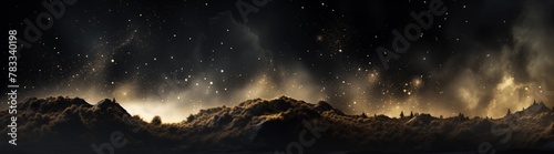 A Majestic Panoramic View of The Starry Night Sky Over Silhouetted Mountains