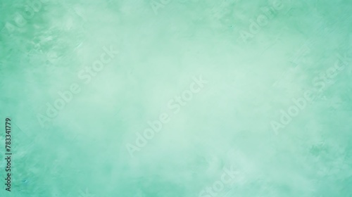 Mint green color. A serene  pastel green textured background with a soft gradient effect perfect for designers and artists to use as a canvas or overlay for their projects 