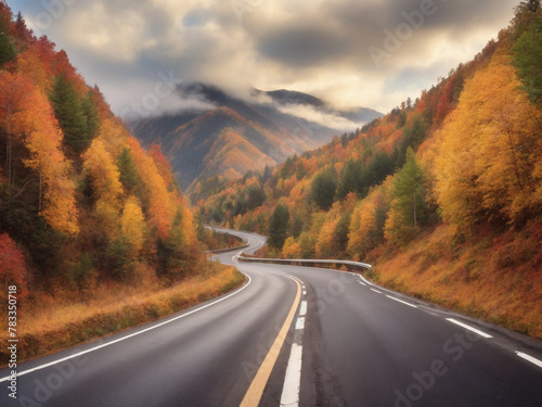 Autumn winding secondary road in the mountain forest