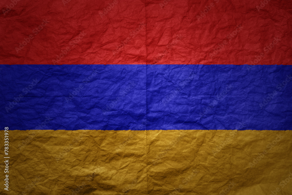 big national flag of armenia on a grunge old paper texture background