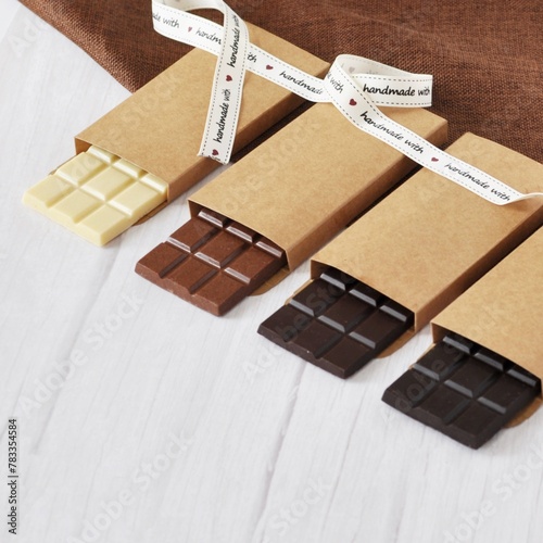 Handmade Chocolate Bars on White Background photo