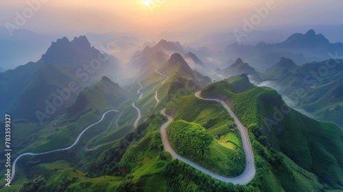 Aerial view of winding mountain road © BrandwayArt