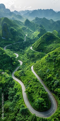 A winding road through lush green valley