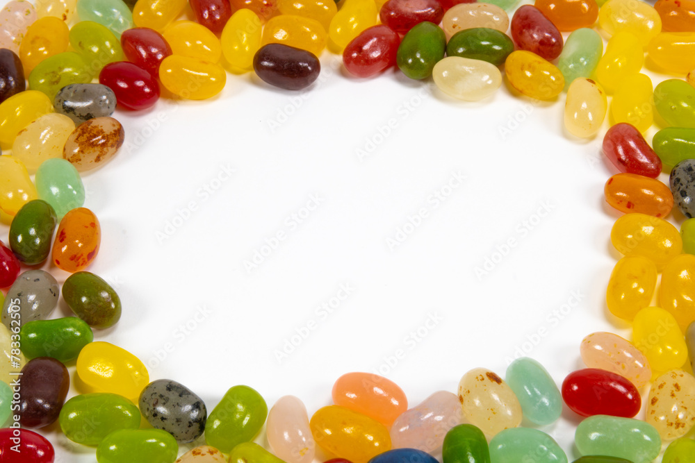 Fototapeta premium Assorted candy beans of various colors on a white background