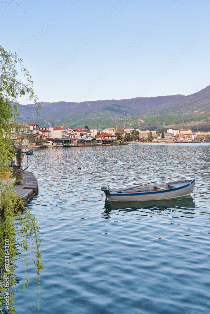 
Lake Ohrid, North Macedonia, April 13 2024. Mountain range and peninsula in distance. Ohrid Lake, Macedonia, Europe. The clear mesmerizing waters of lake Ohrid with a beautiful view. 