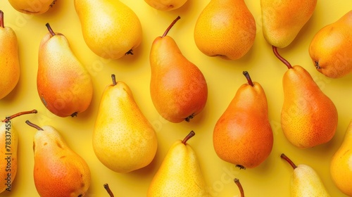 ellow pears pattern. Close up of pear on yellow background. Autumn fruit concept from ripe juicy pears. Flat lay, top view photo