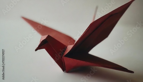red paper dove origami isolated on a white background