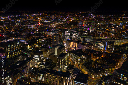 Night time aerial photo of the town centre of Leeds in West Yorkshire UK showing the bright lights of the city and traffic at Christmas time