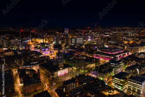 Night time aerial photo of the town centre of Leeds in West Yorkshire UK showing the bright lights of the city and traffic at Christmas time
