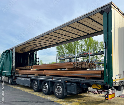 Transportation of wave metal slate in a semi-trailer. Semi-trailer with metal slate