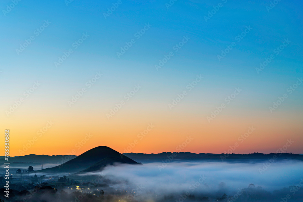 panorama of view of valley, hills, fog, at sunset, sunrise
