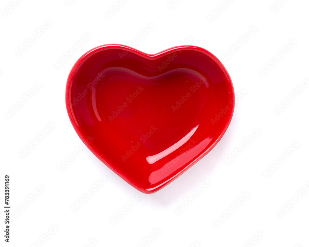 Red heart-shaped bowl isolated on white, top view Red heart-shaped bowl isolated on white, top view