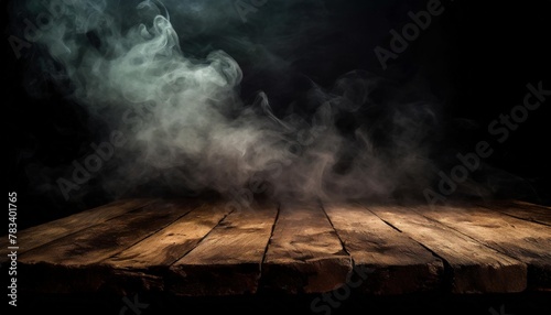 old wood table top with smoke in the dark background photo