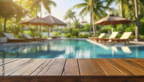 empty wood table top and blurred swimming pool in tropical resort in summer banner background can used for display or montage your products © Mac