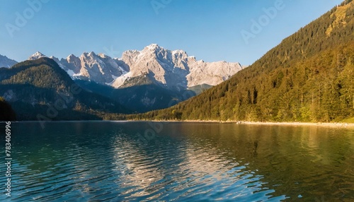 impressive summer sunrise on eibsee lake with zugspitze mountain range sunny outdoor scene in german alps bavaria germany europe beauty of nature