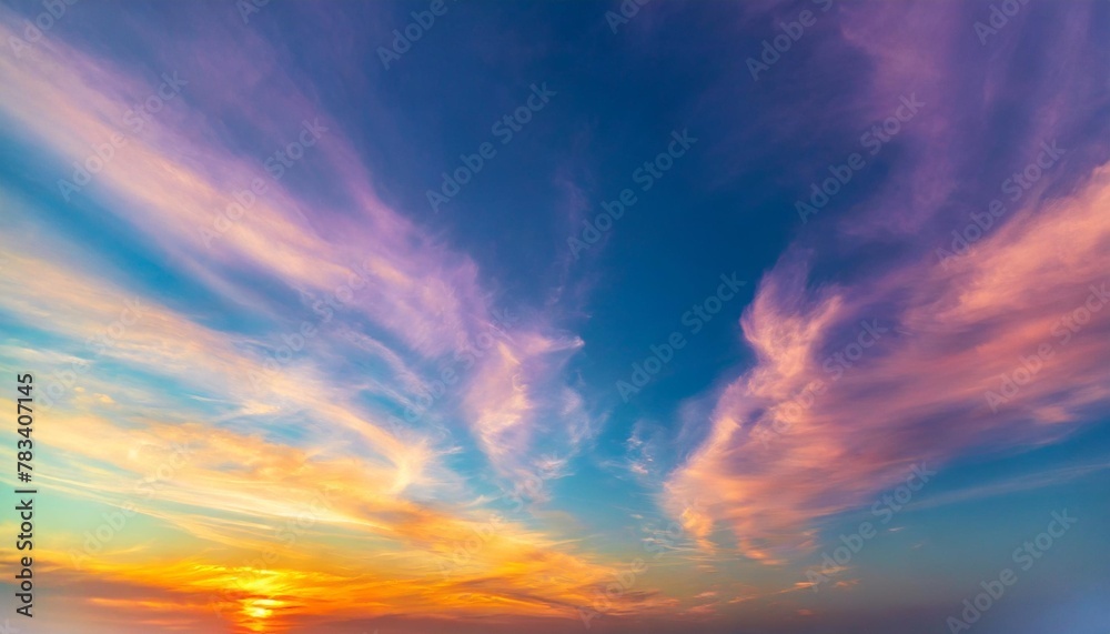vivid sky color background abstract wispy gold purple pink blue green yellow red and orange sunset colors in cloudy artistic pattern fun colorful background