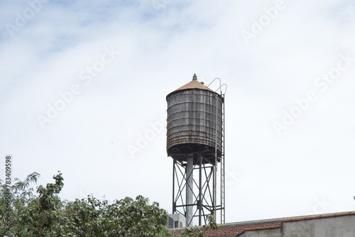 An old wooden water tower on an industrial building