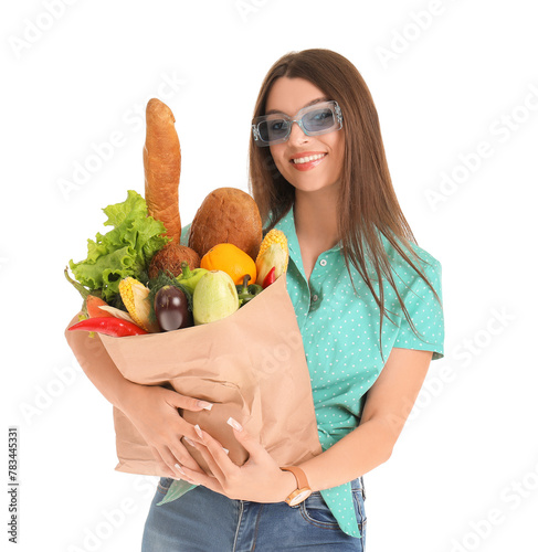 Young woman holding paper b...
